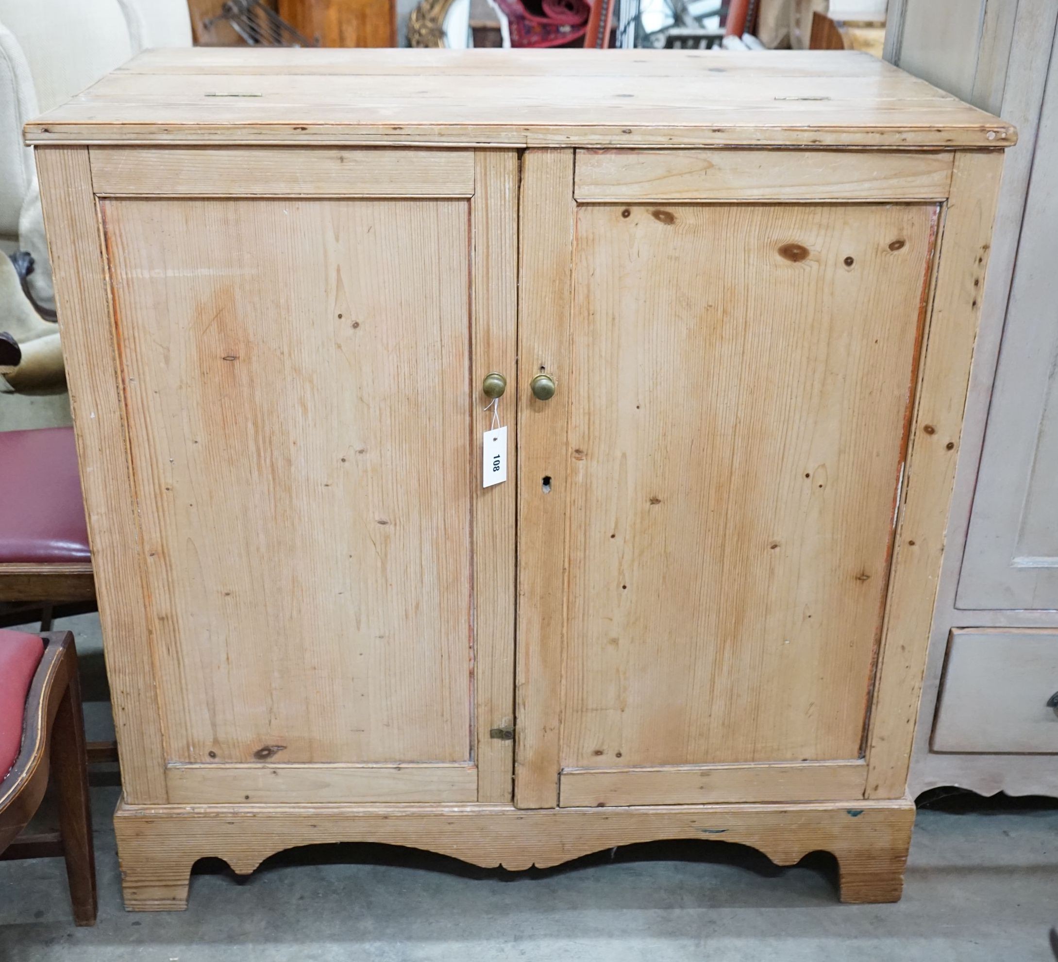 A 19th century pine part hinged top press cupboard, length 107cm, depth 61cm